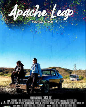 Movie Poster with text Apache Leap over image of blue sky two people lean again car in desert